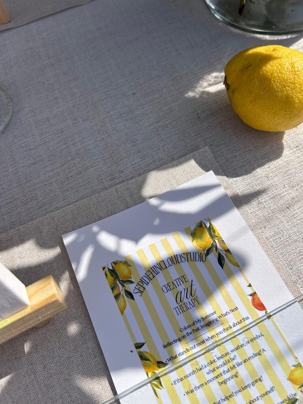 A lemon beside a creative art therapy prompt card